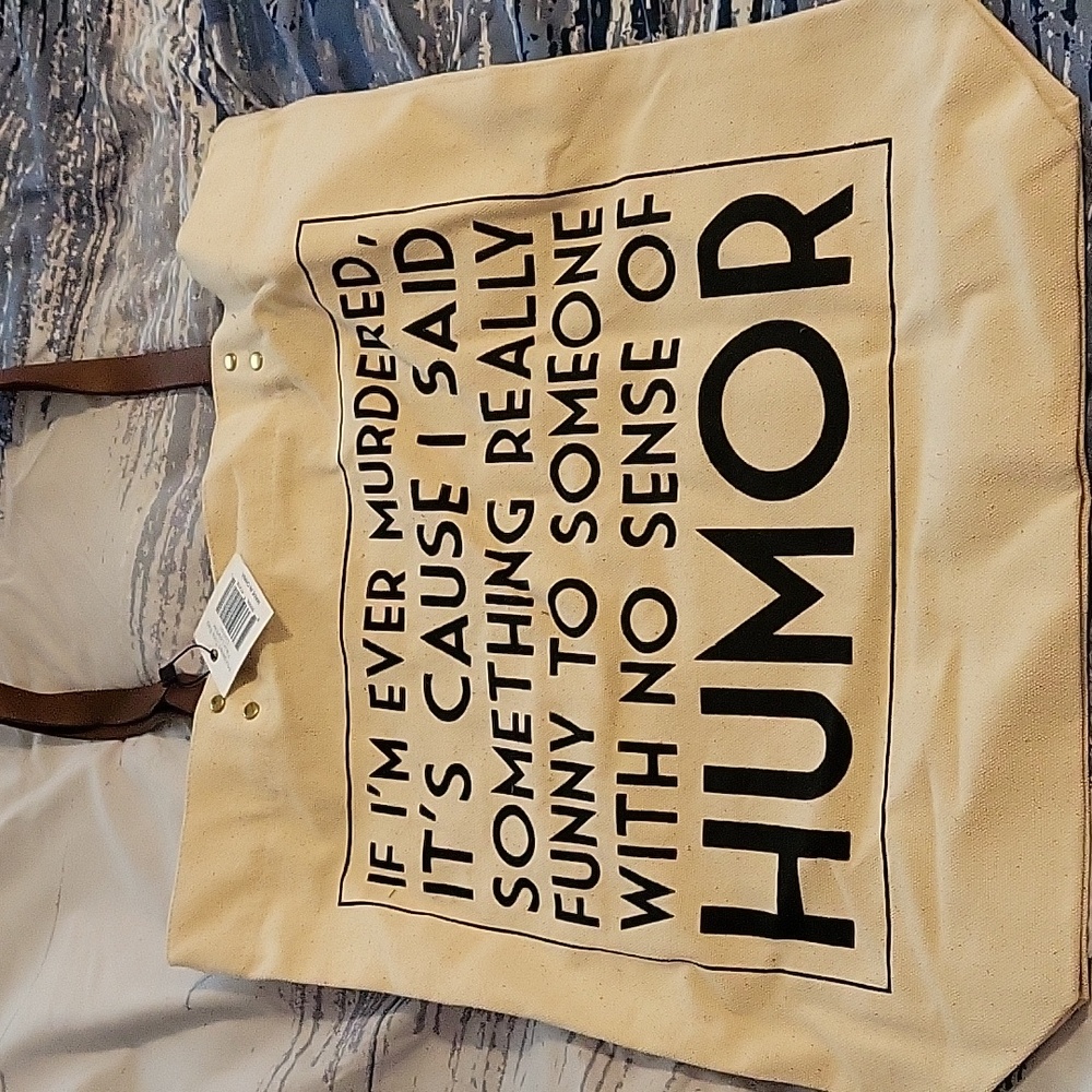 Canvas tote bag with faux leather straps.